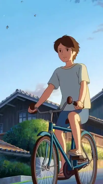 A boy rides his bicycle up a quiet hill in the morning